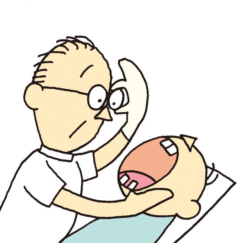 歯の健診をしている歯科医の画像